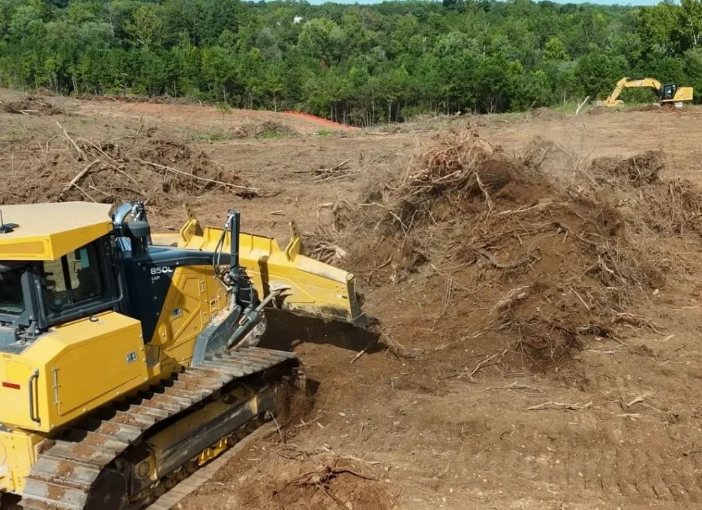 Bulldozer pushing tree debris
