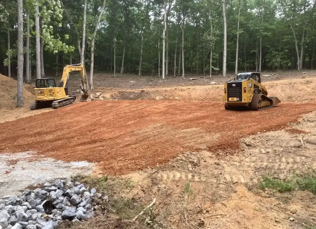 Excavators grading red soil
