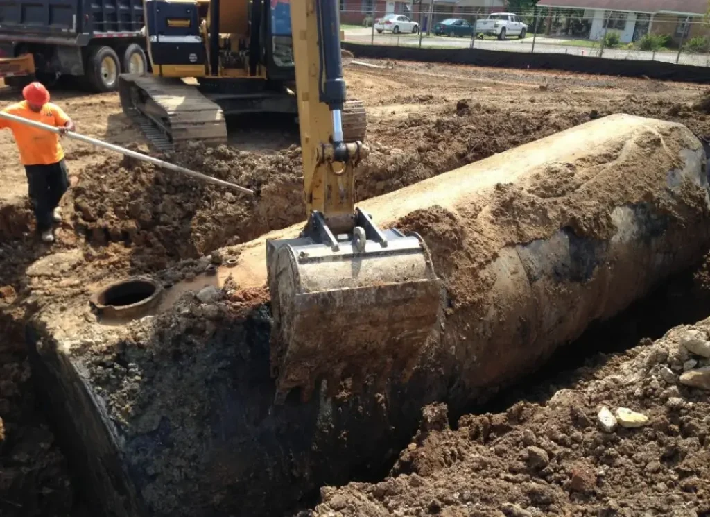 Excavator digging utility trench.